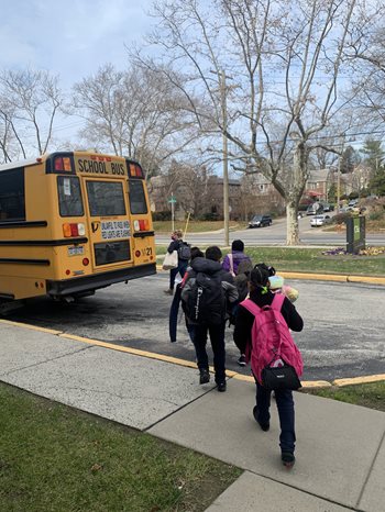 Children getting on bus