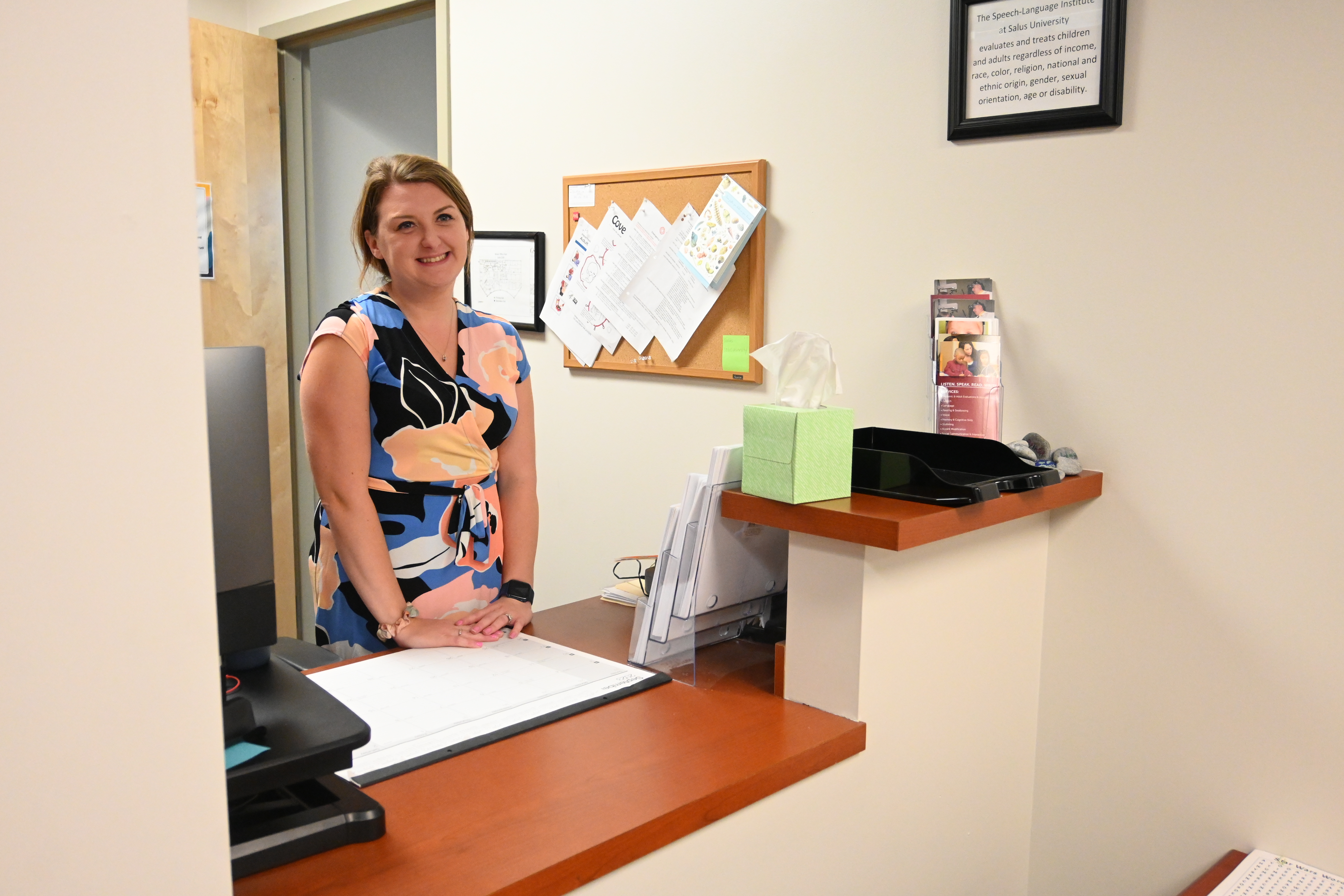 Taylor at SLI front desk