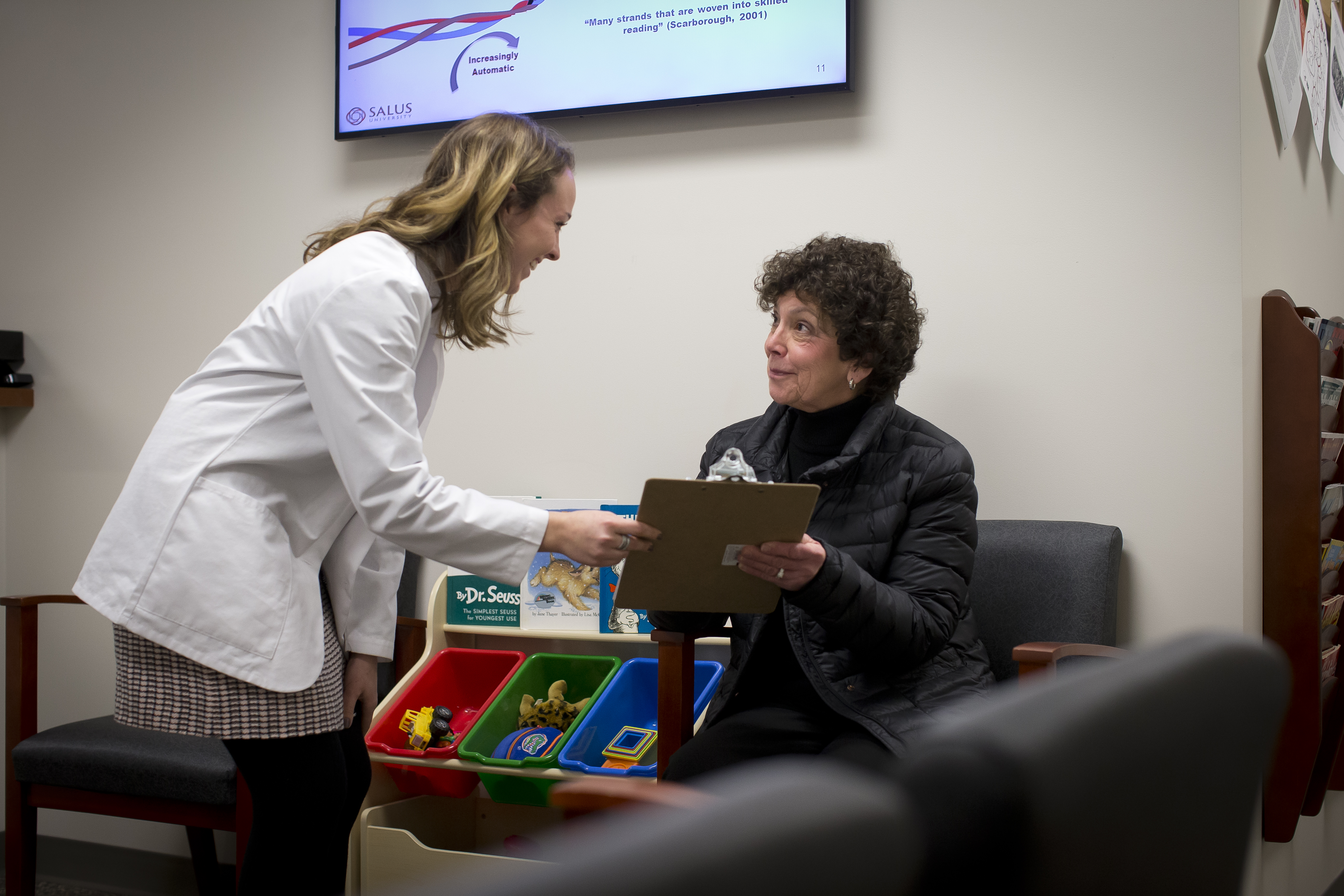 Clinician talking to patient