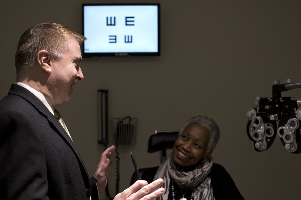 Dr. Carlo Pelino talking with a patient