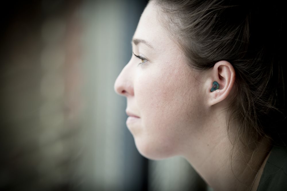 Woman wearing ear plugs