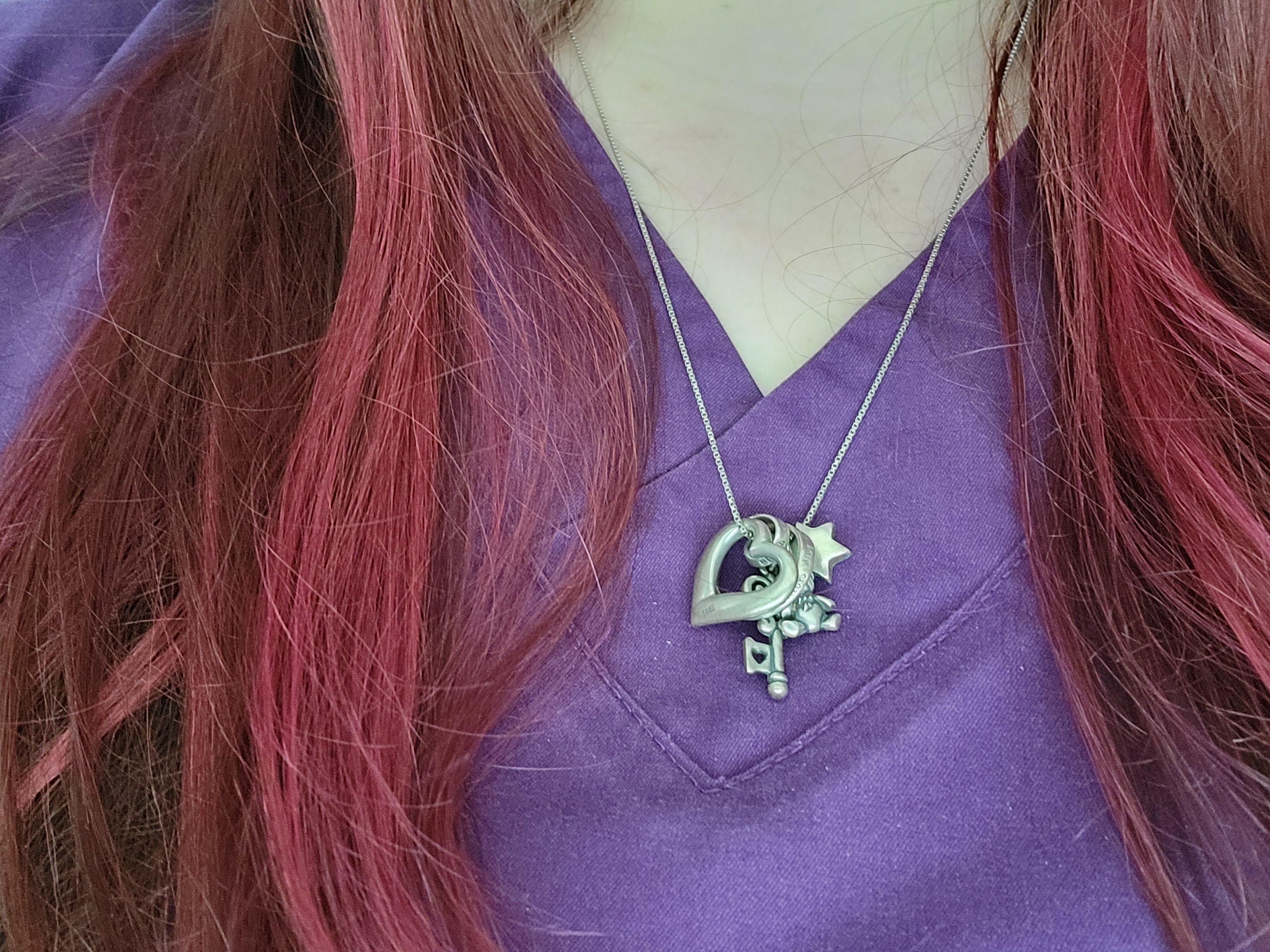 Dr. Ayars red hair and necklace