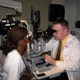 Optometrist examining a patient