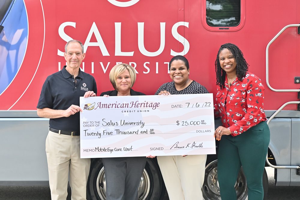 American Heritage check presentation to Salus