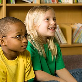 Two children sitting on the floor