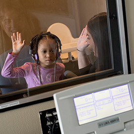 pediatric patient in audiology booth