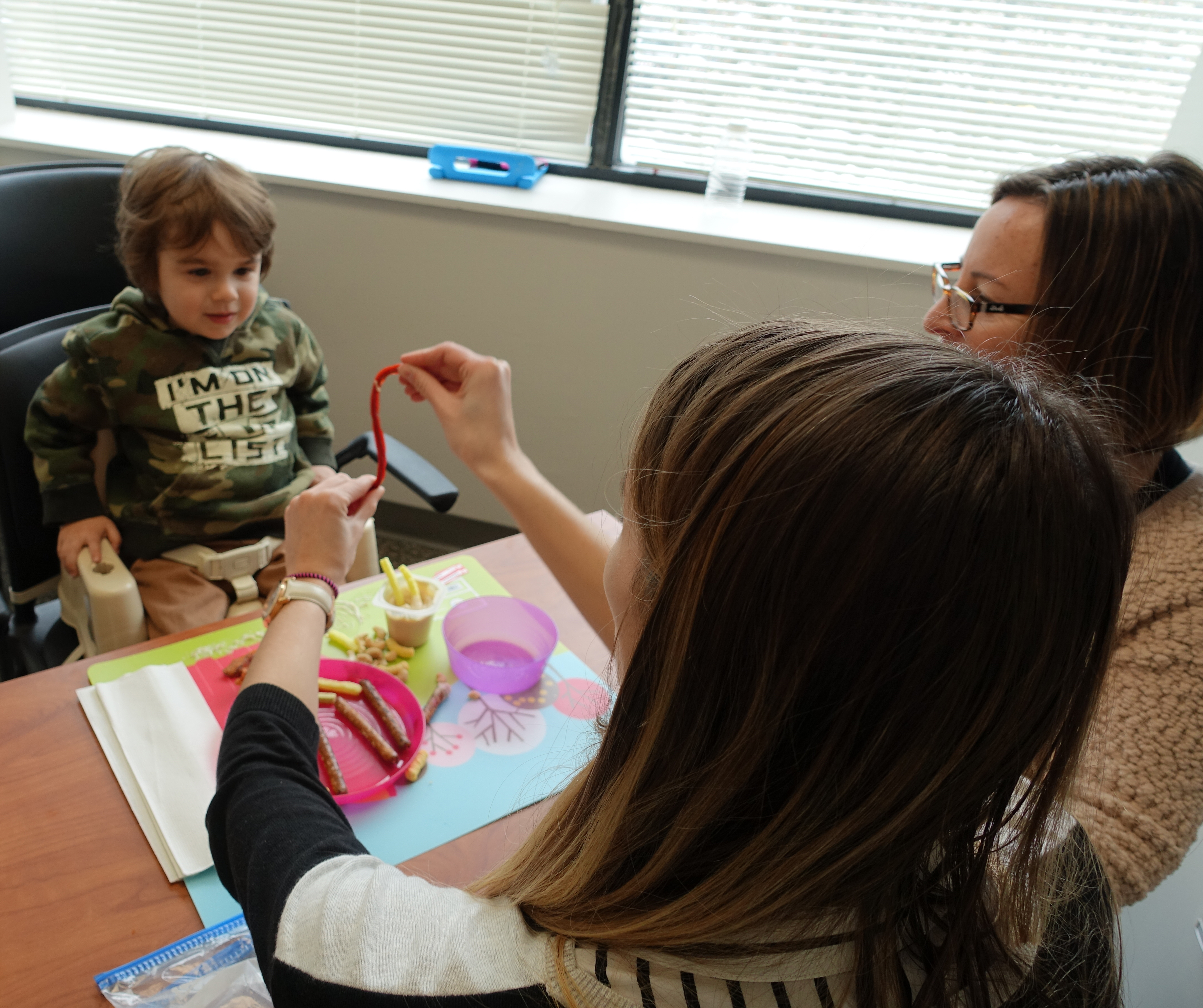 clinician working with pediatric patient