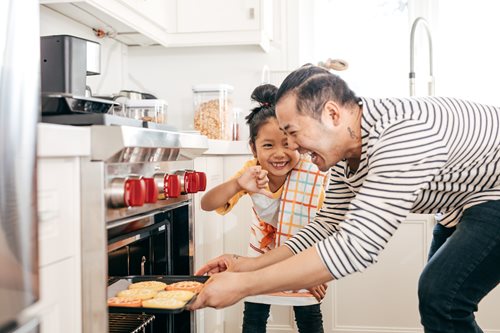 Father and daughter baking