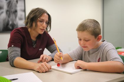 Brianna Brim working with male pediatric patient