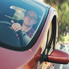 man driving a car