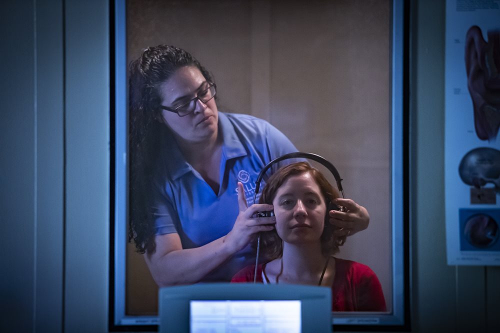 Woman having a hearing exam