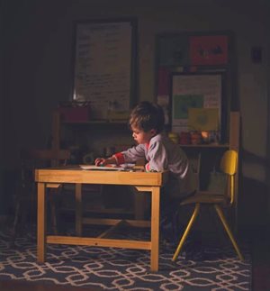 Young boy sitting at a desk