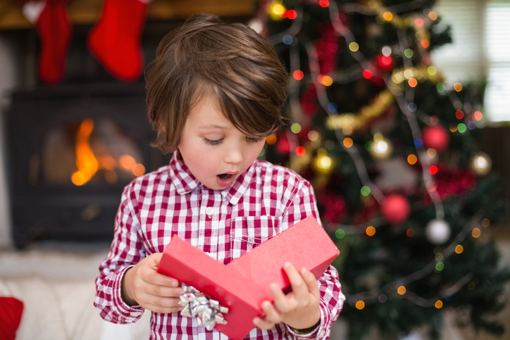 child opening a christmas gift