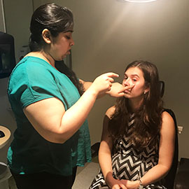 Optometrist working with patient