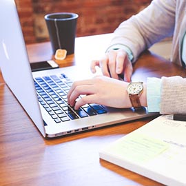 Person typing on a computer