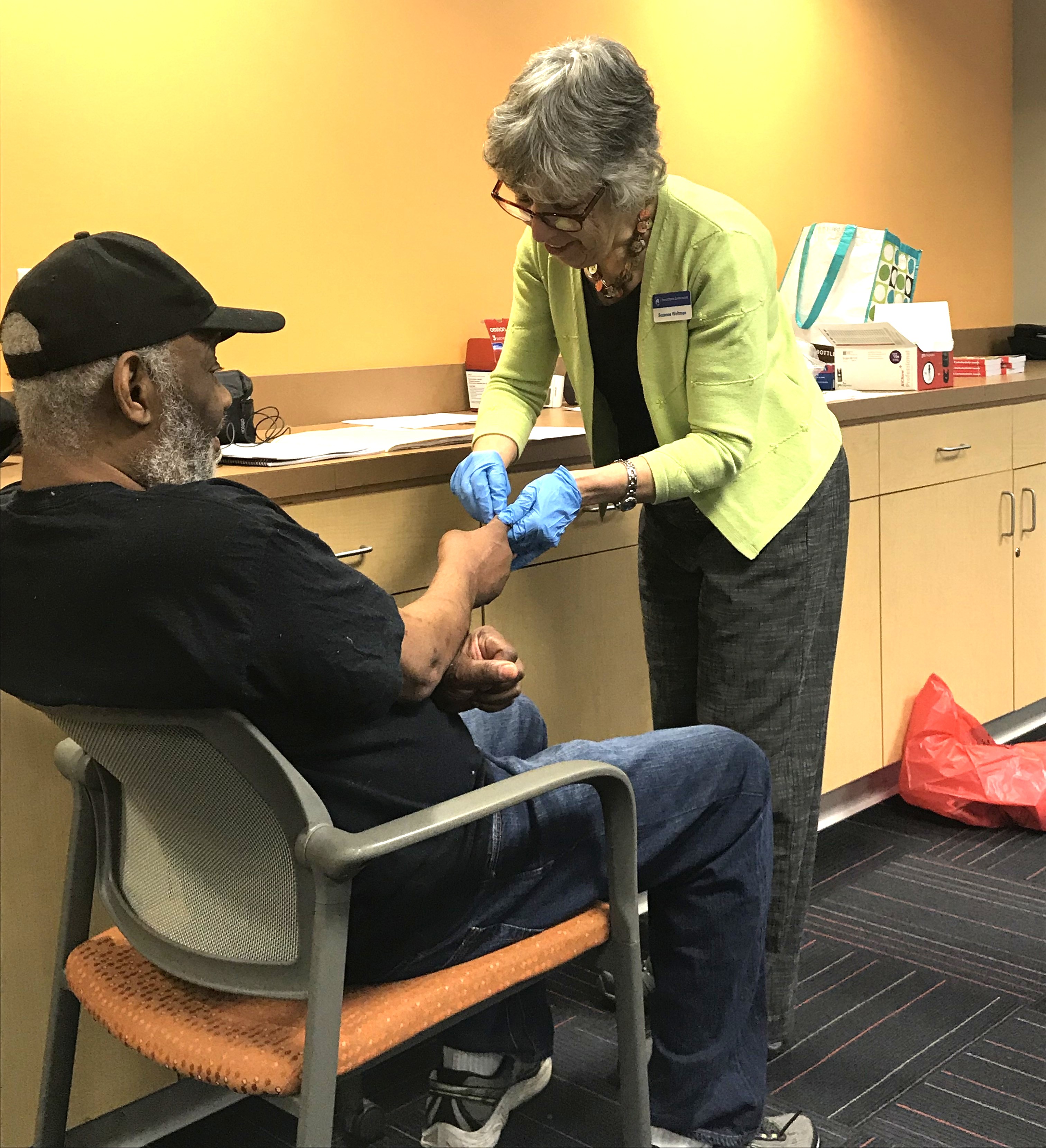 Patient being tested for blood suger photo