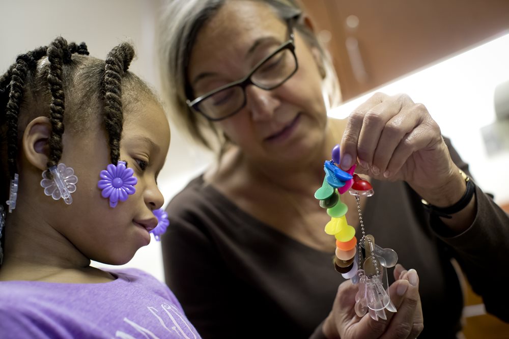 Dr. Owen working with a pediatric patient