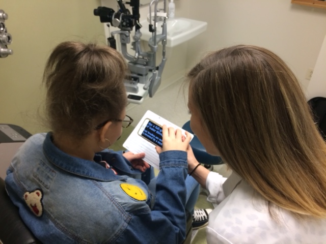 Dr. Erin Kenny working with a patient