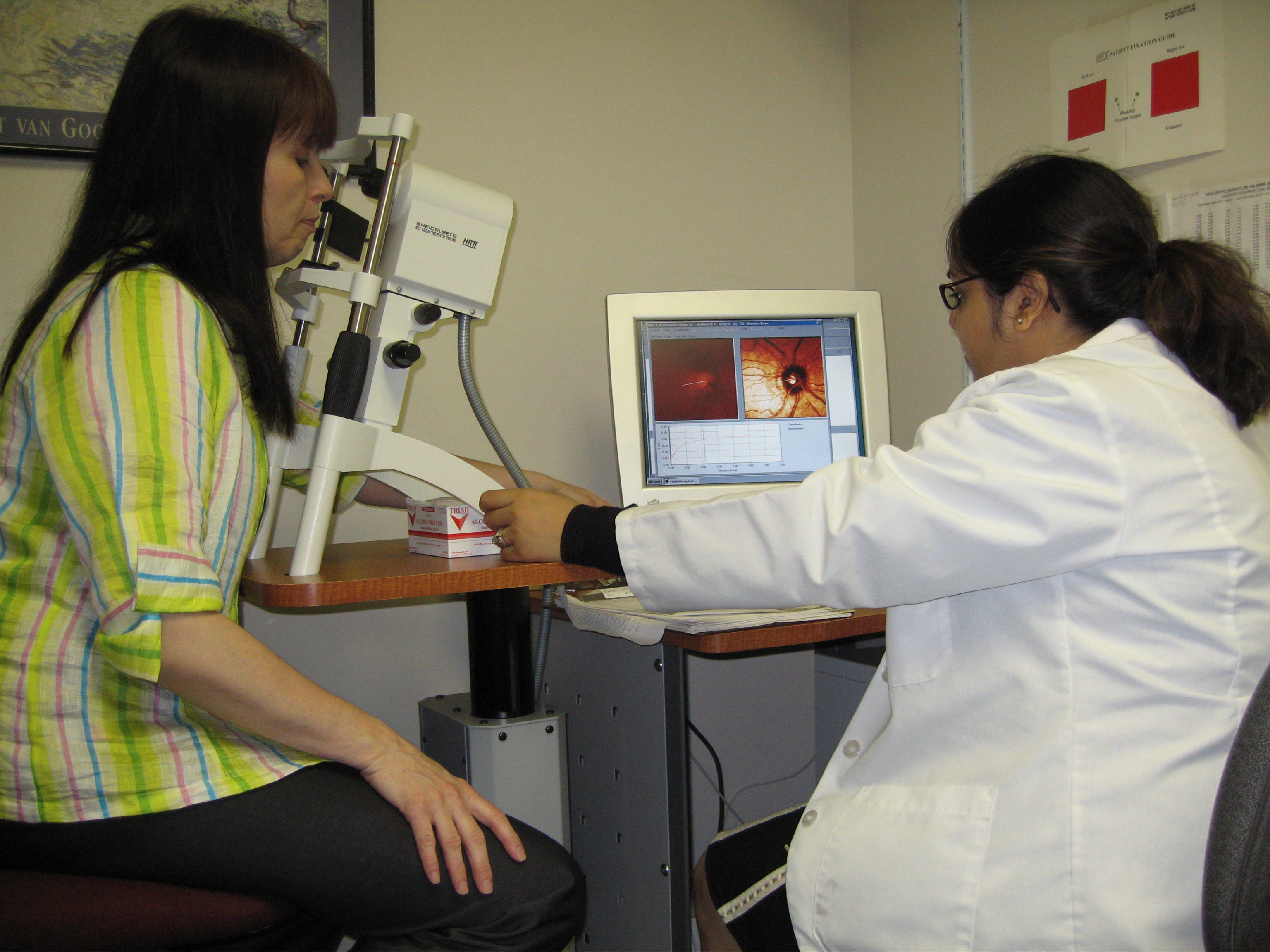 Patient getting an eye exam from student