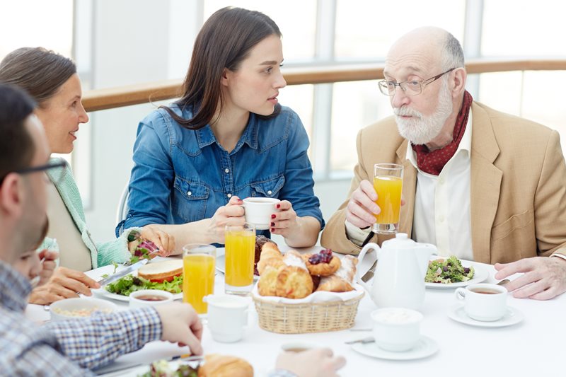 Family eating breakfast together