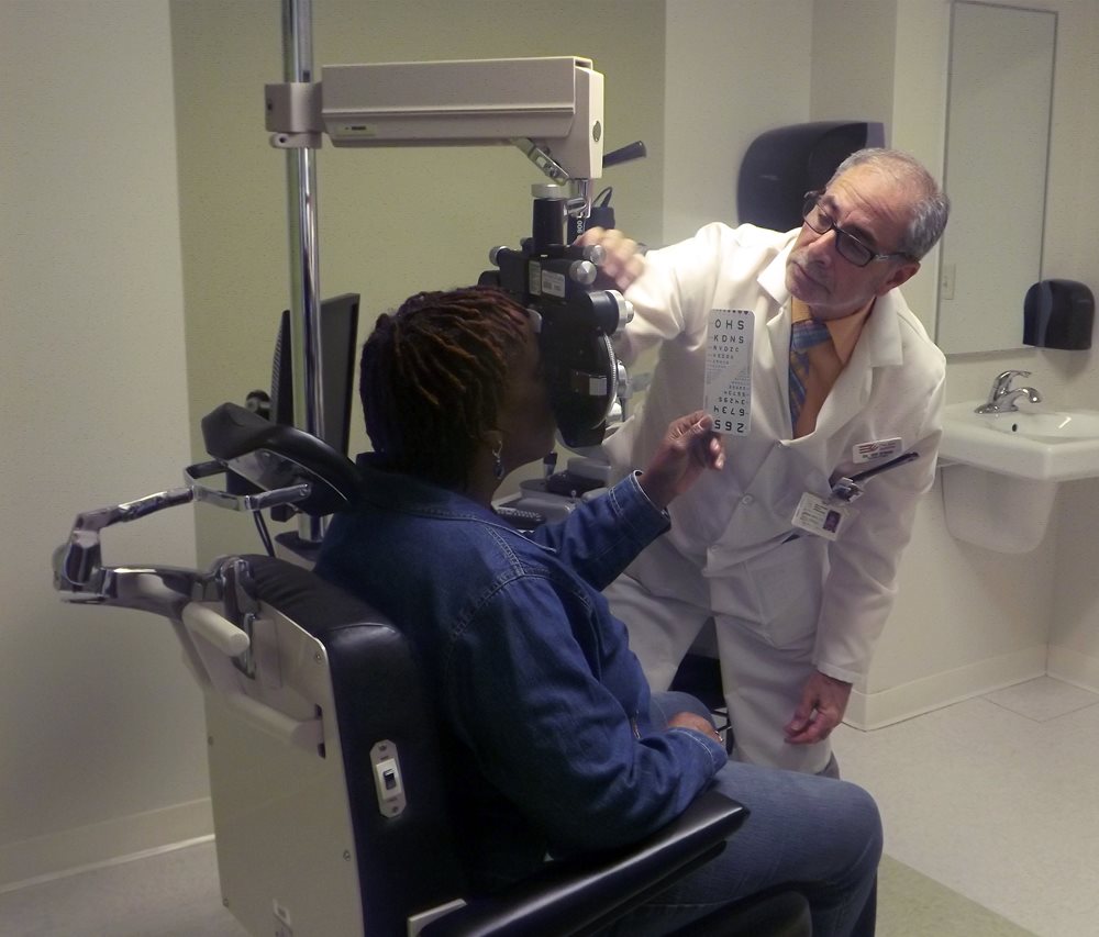 Dr. Nyman providing an eye exam to a patient