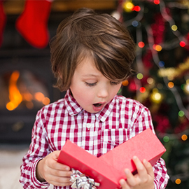 child opening a gift