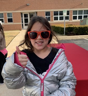 Young girl wearing sunglasses