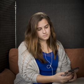 Young girl wearing ear buds