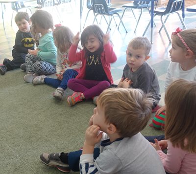 Group of children sitting on the floor at school