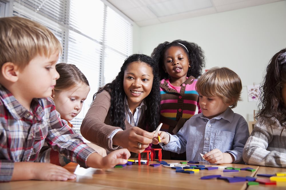 Group of kids and an adult playing