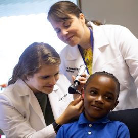 School boy having hearing checked