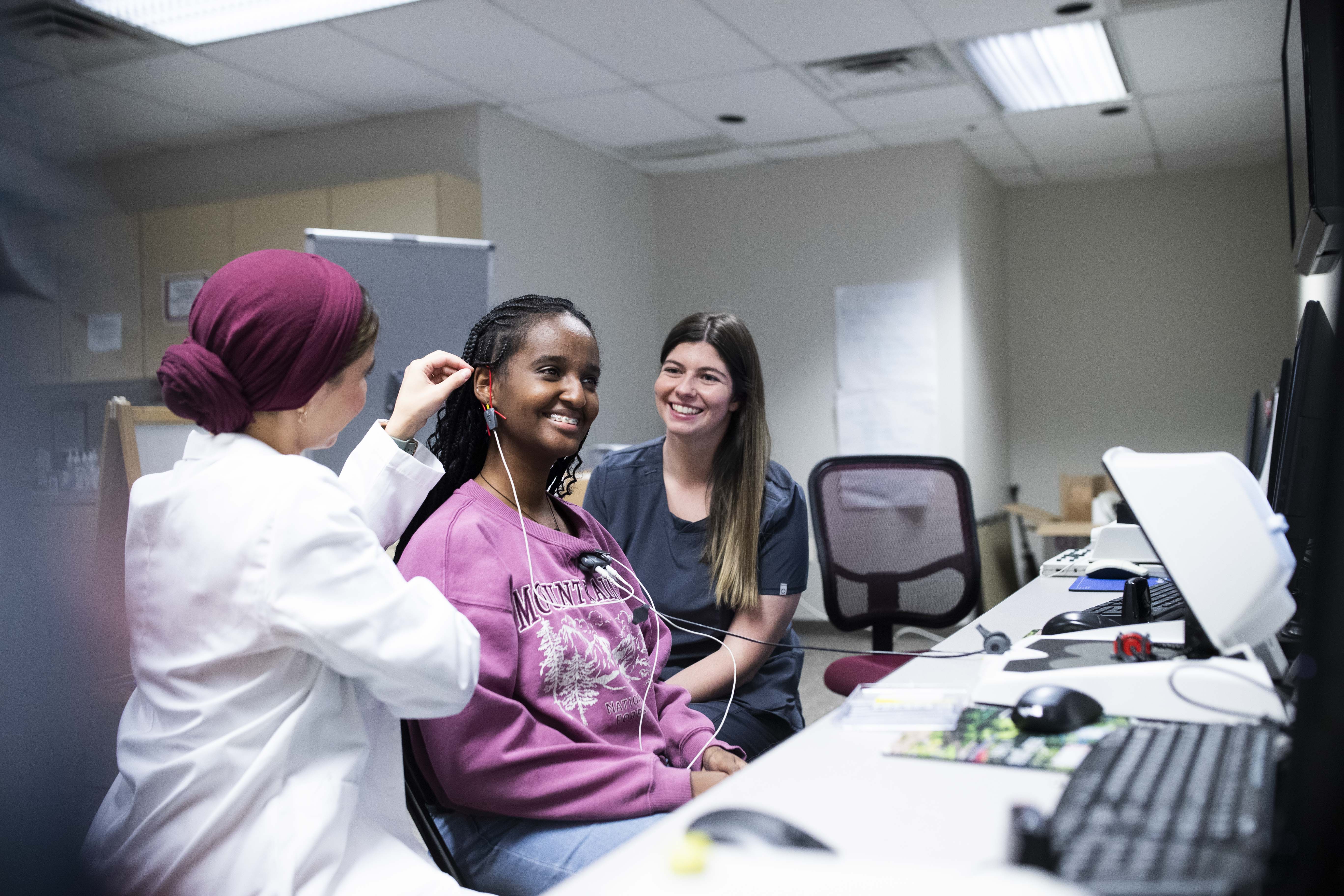 Students treat patient in the lab