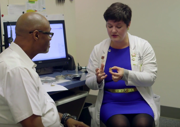 Dr. Blaha working with a patient