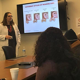 PEI doctor giving presentation on hearing aids