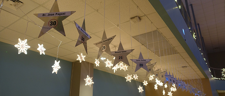 Stars with faculty and staff names hanging from the ceiling