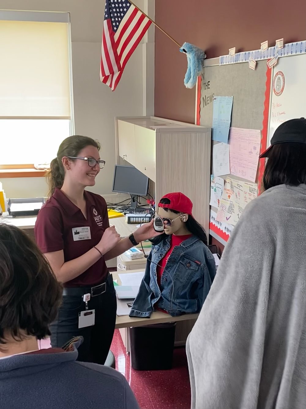 audiology student with high school student