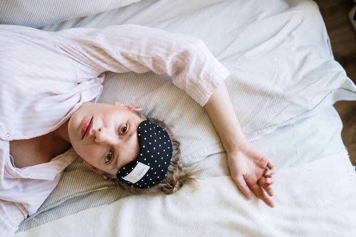 Woman laying awake in bed