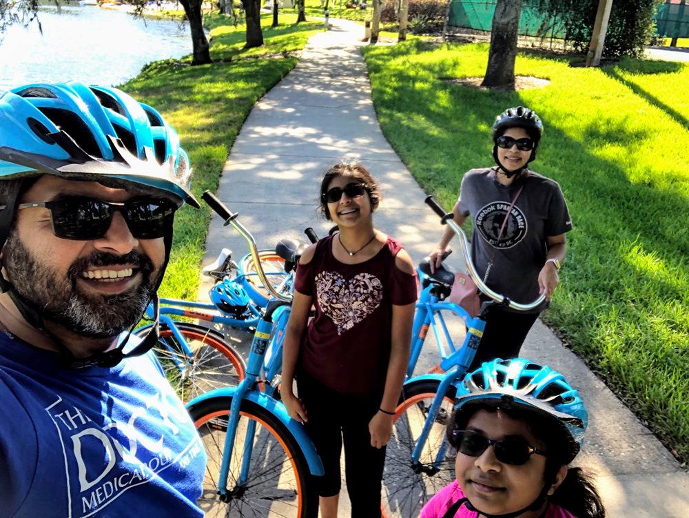 Dr. Rajan and family cycling