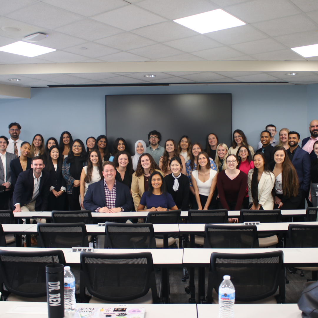 All of the residents together for picture in conference room after their presentation