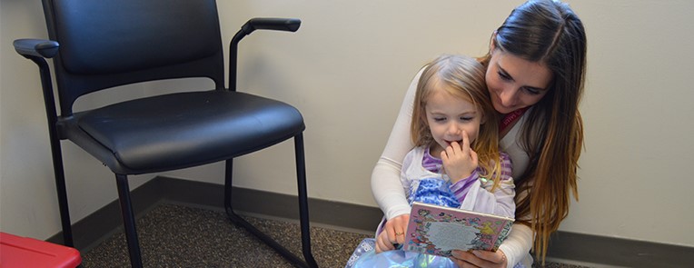 Student reading to a child