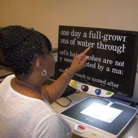 Woman using low vision computer 