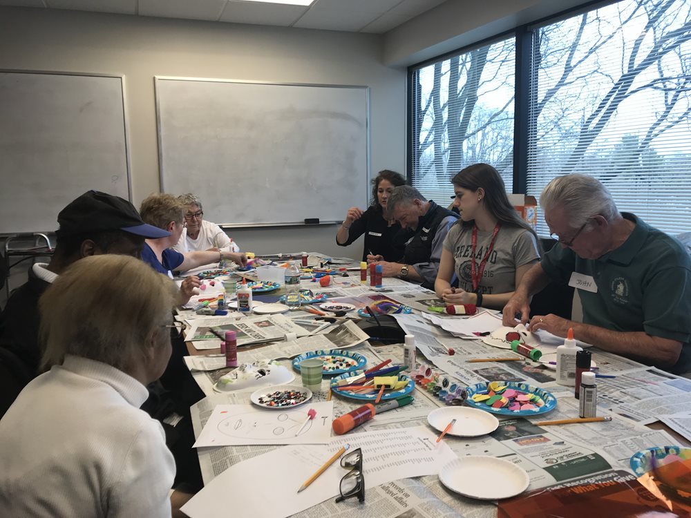 Brain injury support group working on mask project