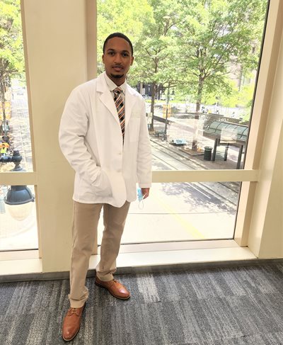 Brandon Garces wearing his white coat