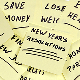 New Years Resolutions written on a post-it note