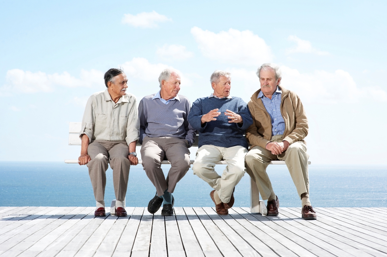 older men on bench talking