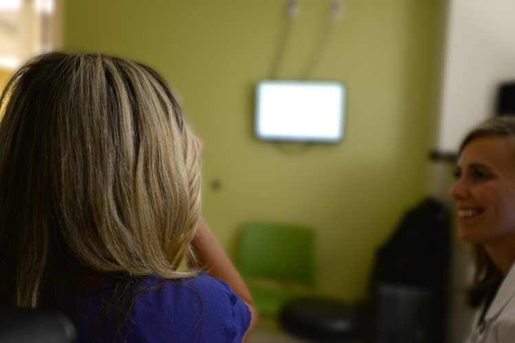 Dr. Erin Kenny working with a pediatric patient