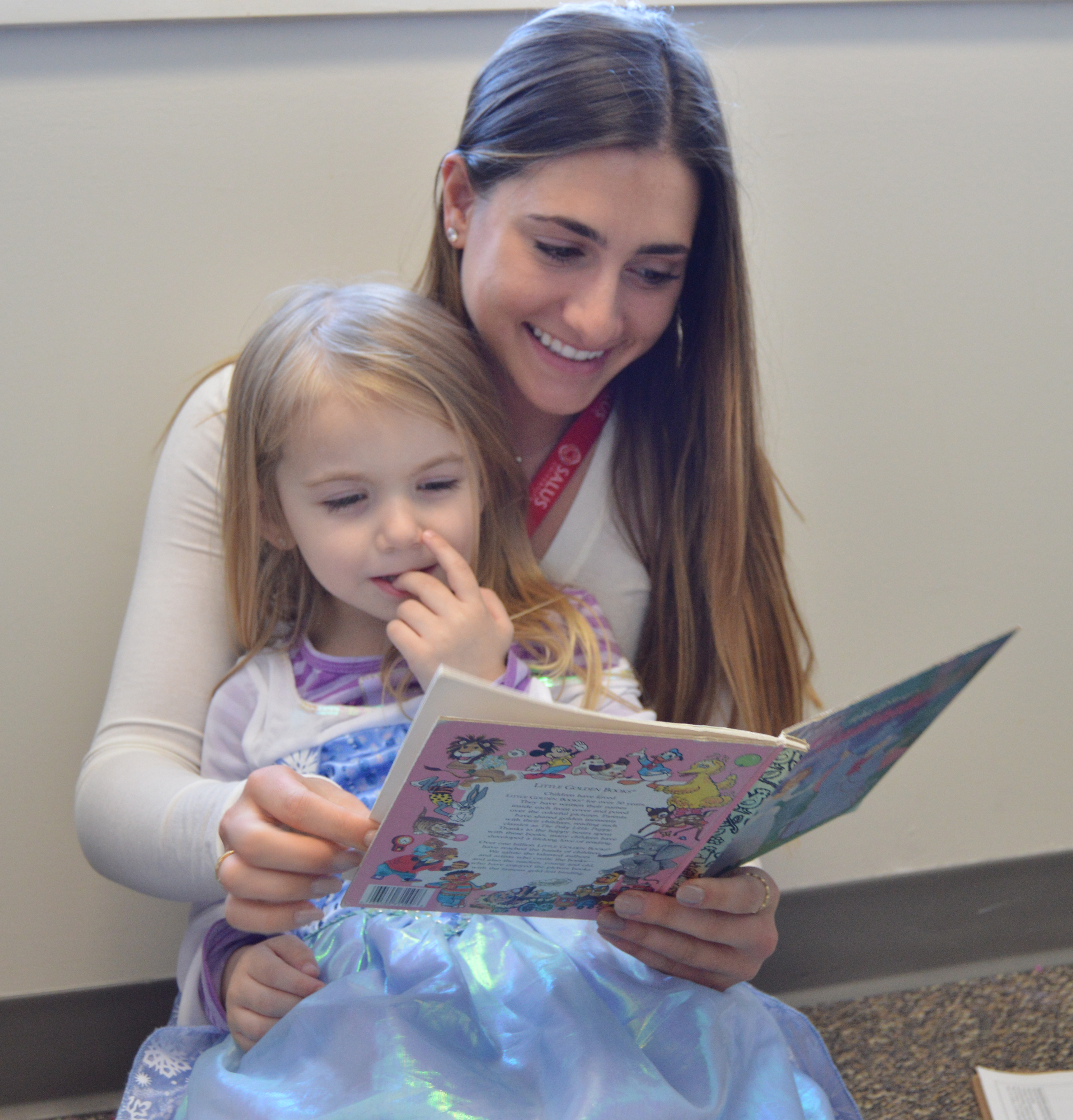 SLI clinician reading to pediatric client