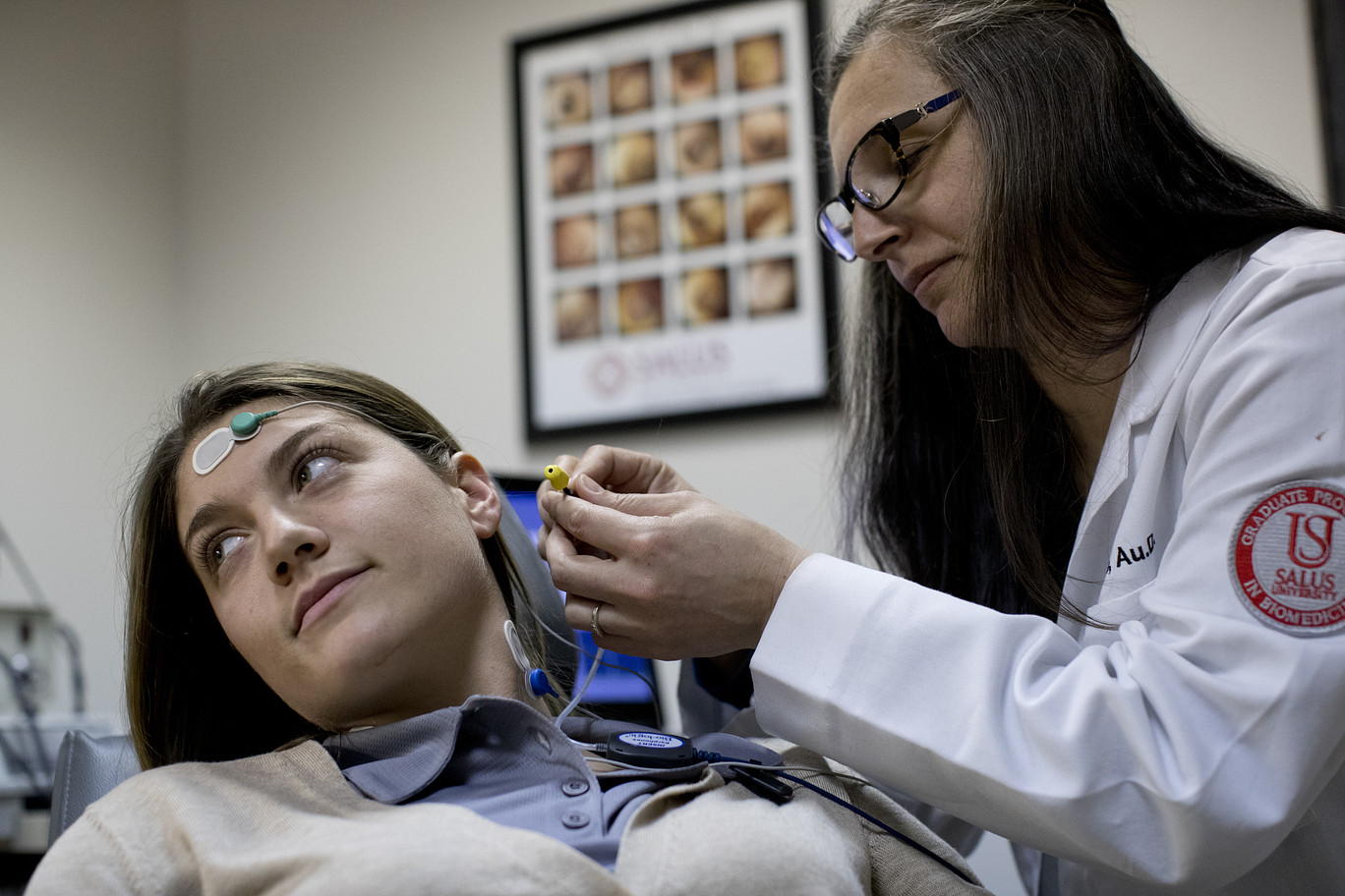 Kelly Malloy with patient in lab