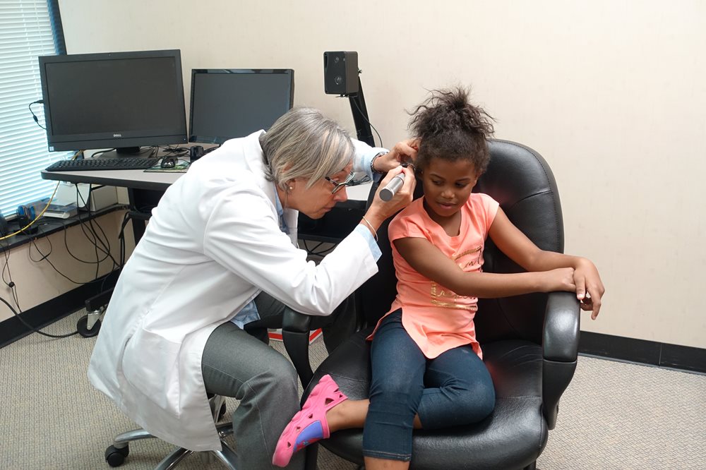 Young girl having hearing test