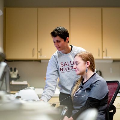 Student administering audiology test 